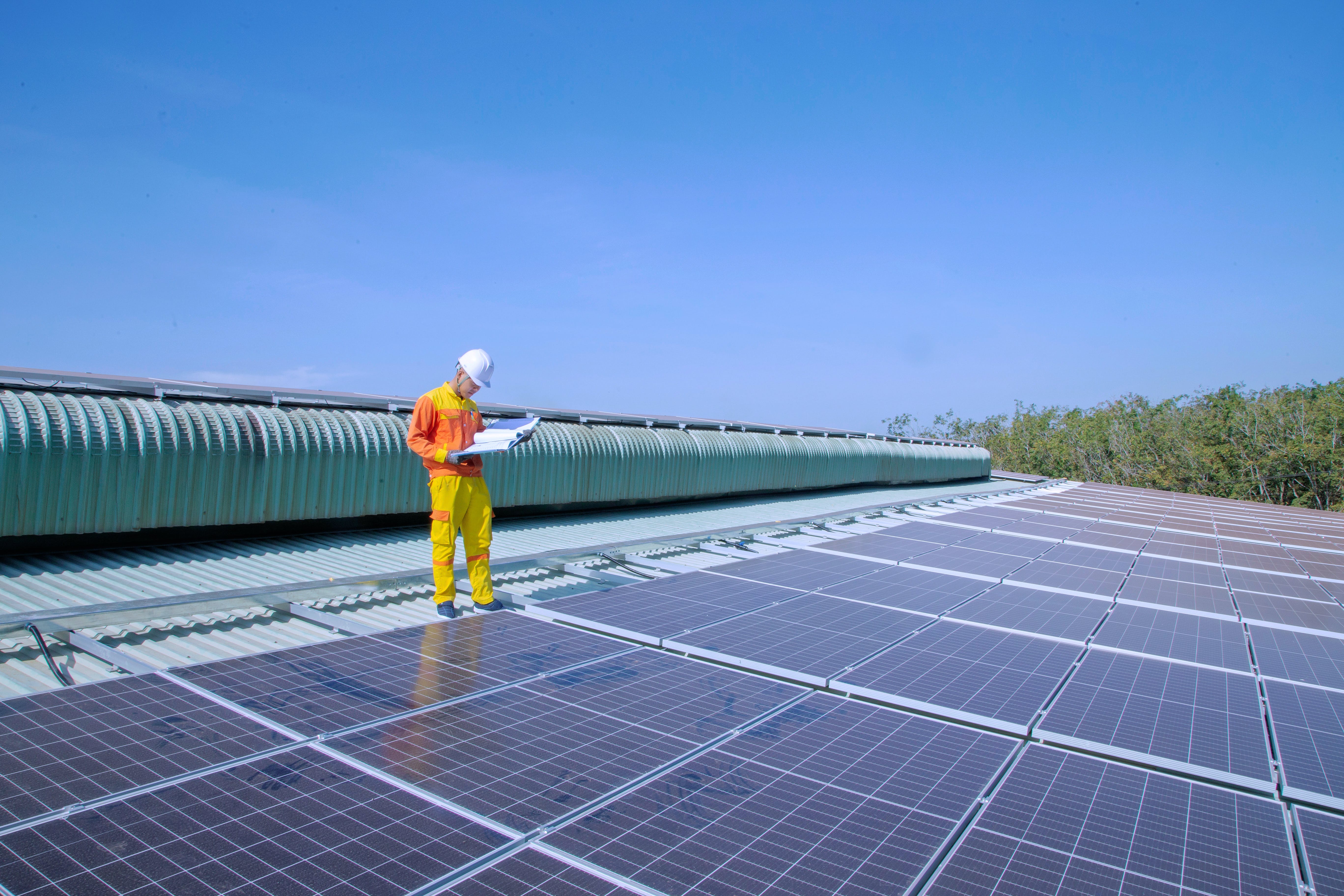 Engineer inspecting a roof.